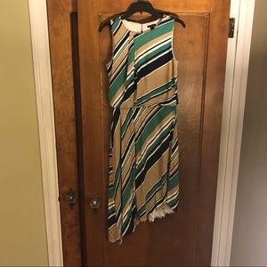 Sleeveless asymmetrical dress.